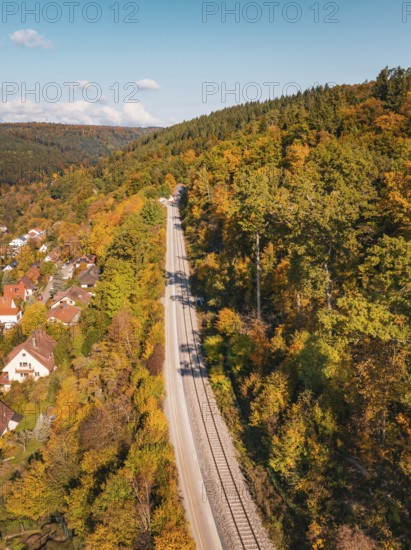 Railway tracks through autumn landscape with hills and a village, Bau der Hermann, Hesse, Bahn, Calw, Germany