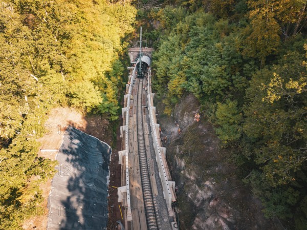 Rail construction site in the forest taken from the air with tunnel boring machine, construction of Hermann, Hesse, Bahn, Calw, Germany