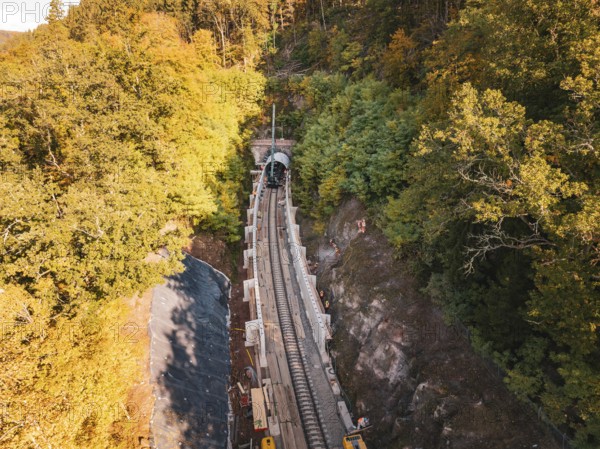Aerial view of an autumn rail construction site in the forest, Hermann building, Hesse, railway, Calw, Germany