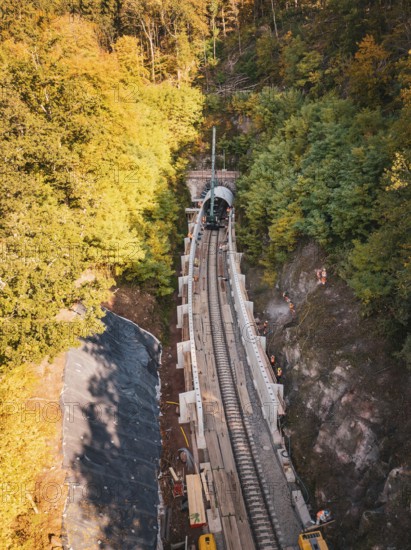 Autumn forest construction site taken from the air with a tunnel boring machine, construction of Hermann, Hesse, Bahn, Calw, Germany