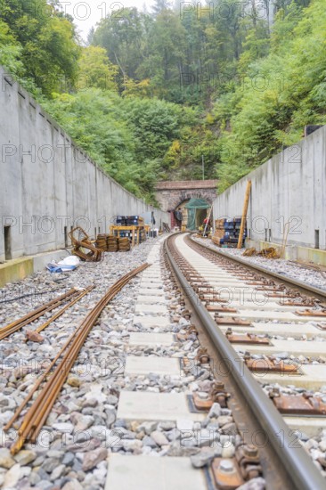Track construction at a tunnel in the forest under clear skies, construction of Hermann, Hesse, Bahn, Calw, Germany
