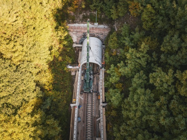Aerial view of a construction site with a tunnel boring machine in a wooded area on railroad tracks, Bau der Hermann, Hesse, Bahn, Calw, Germany