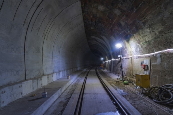 Tunnel with illuminated rails, cabling and modern technology, built by Hermann, Hesse, Bahn, Calw, Germany