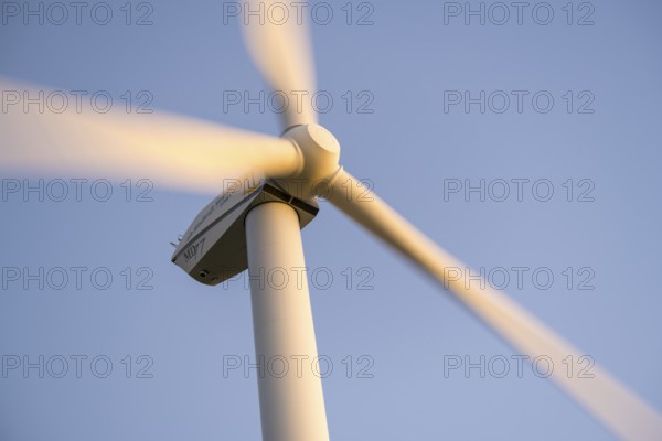 Wind turbine in full motion under a blue sky, Baden-Württemberg, Germany