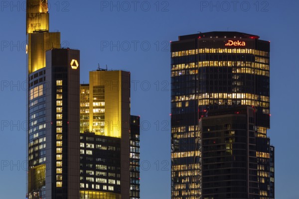 The towers of Commerzbank and Deka Bank in Frankfurt am Main light up in the evening, Frankfurt am Main, Hesse, Germany