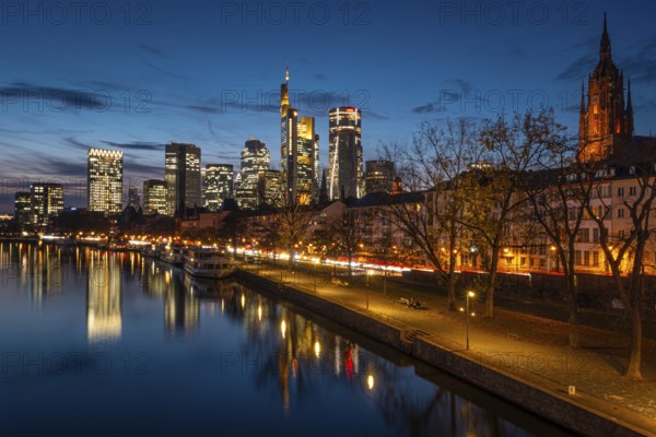 The Frankfurt banking skyline is reflected in the evening in the Main, Frankfurt am Main, Hesse, Germany
