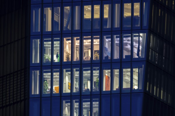 The lights are on in the evening at the offices of the European Central Bank (EBZ) in Frankfurt am Main, Frankfurt am Main, Hesse, Germany