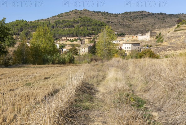 View from fielding countryside to rural houses village of Uncastillo, Cinco Villas, Zaragoza province, Aragon, Spain