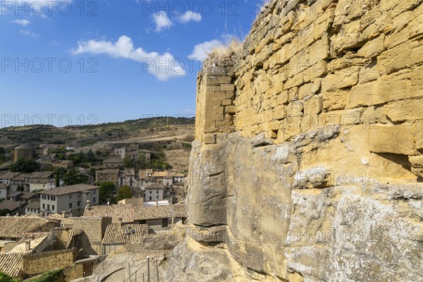 Castle walls built on rock outcrop, medieval village of Uncastillo, Cinco Villas, Zaragoza province, Aragon, Spain