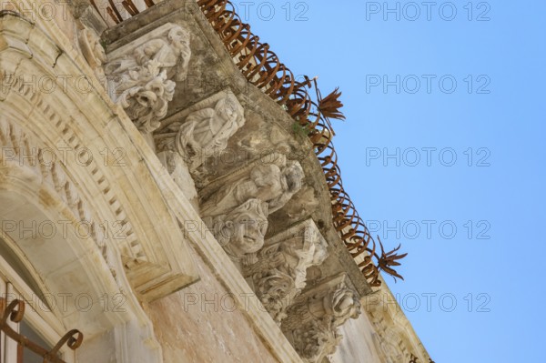 Baroque balcony, Palazzo Cosentini, Ragusa Ibla, Ragusa province, Sicily, Italy