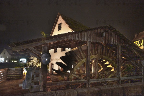 Nocturnal view of historic Schleifmühle waterwheel, Lauf an der Pegnitz, Middle Franconia, Bavaria, Germany