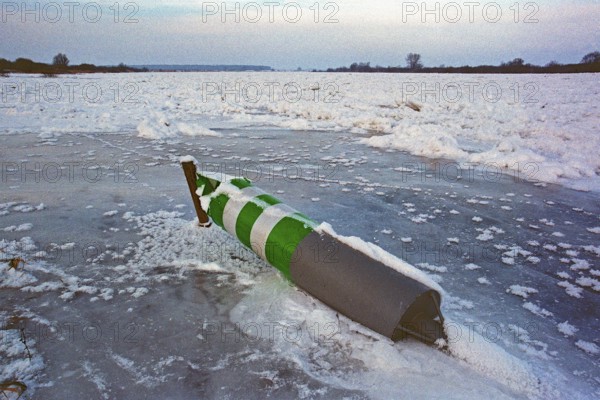 Buoy lying on ice rink, frozen Elbe, Bleckede, Lower Saxony, Germany, January 03, 1997, vintage, retro, old, historic