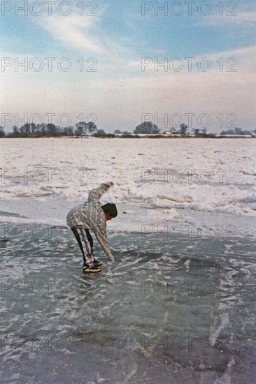 Boy on ice rink, frozen Elbe, Bleckede, Lower Saxony, Germany, January 03, 1997, vintage, retro, old, historic