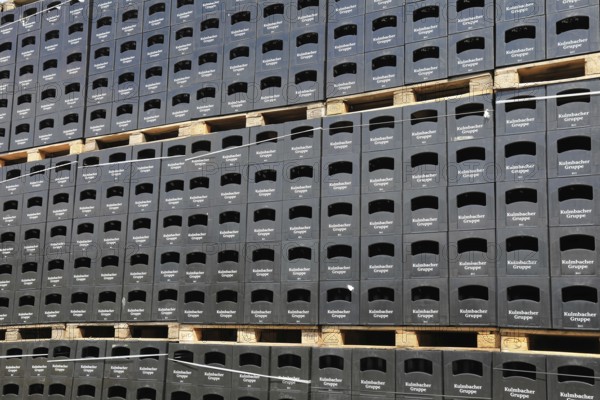 Stacked black beer crates from the Kulmbacher Group, a beverage manufacturer that includes Kulmbacher Brauerei AG and other breweries such as Sternquell, Braustolz and Würzburger Hofbräu, editorial