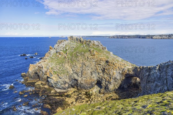 Seascape view to the horizon from a rocky coast a sunny summer day by the sea, Crozon peninsula, Bretagne, France
