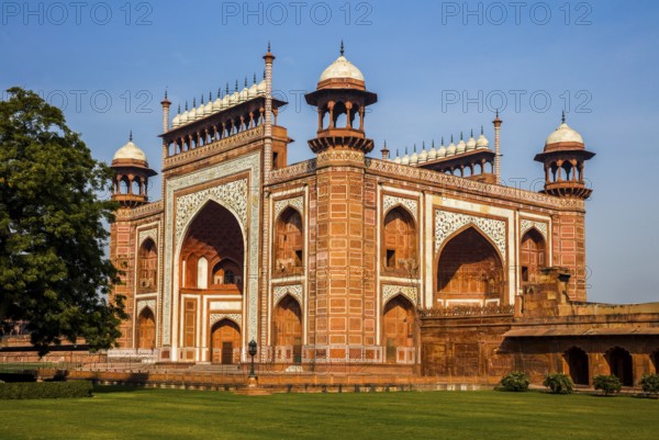 Red sandstone entrance gate, Taj Mahal, most famous building of the Mughal period in Agra