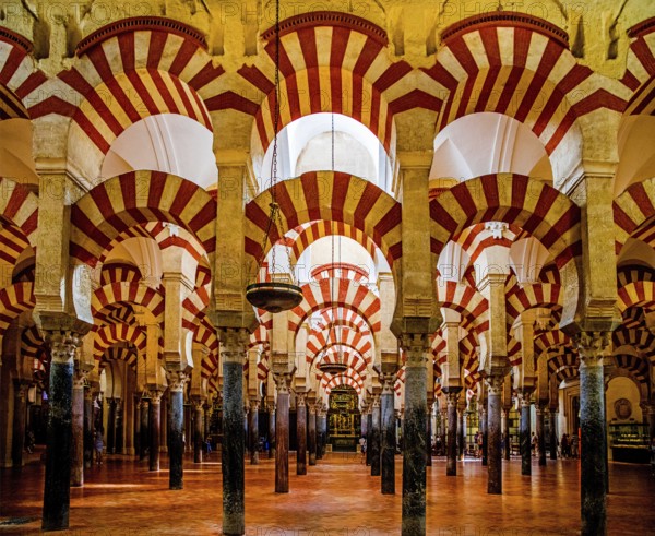 Columned forest with alternating use of brick and stone and red and white paint, Mezquita, Cordoba, Cordoba, Andalusia, Spain