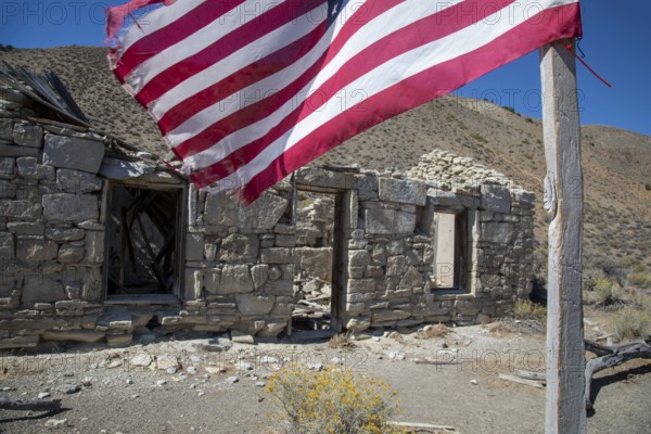 Austin, Nevada - A flag flies beside the ruins of the Walters station on the Nevada Central Railroad. The NCRR was a narrow gauge railroad opened in 1880 during a silver mining boom