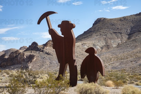 Beatty, Nevada - Art is the attraction in Rhyolite, a town that boomed briefly after gold was discovered in 1904. A sculpture shows a gold prospector with his penguin