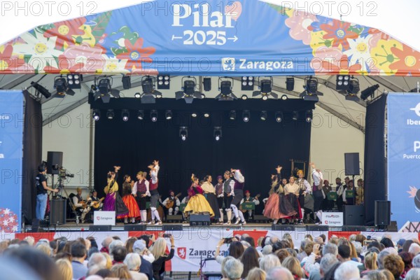 Folk dancers performing on stage as part of Pilar 2025 festival event, Zaragoza, Aragon, Spain