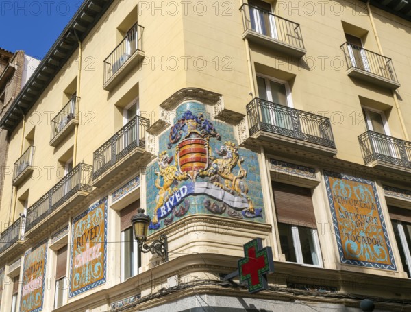 Historic Rived family crest on street corner of above pharmacy shop, Zaragoza, Aragon, Spain