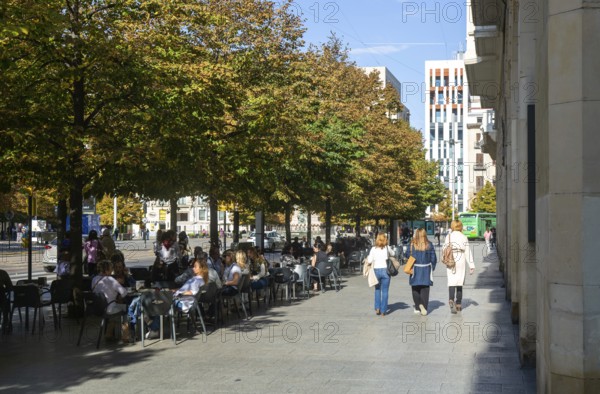People sitting outside at street cafe near Plaza de Espana, Zaragoza, Aragon, Spain