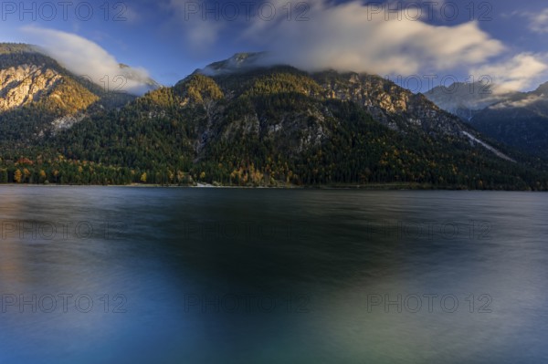 Mountain lake, evening light, mountains, windy, clouds, autumn, autumn color, Plansee, Tyrol, Austria