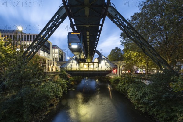 Night view of the Wuppertal suspension railway at Ohligsmühle station, Wuppertal, Germany, digitally reworked