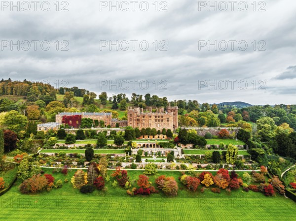 Autumn colours over Powis Castle and Garden from drone, Welshpool, Powys, Wales, England, United Kingdom