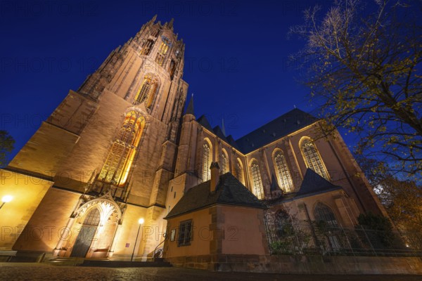 Numerous spotlights illuminate St. Bartholomew's Cathedral in Frankfurt am Mainzur Blaue Stunde, Frankfurt, Hesse, Germany