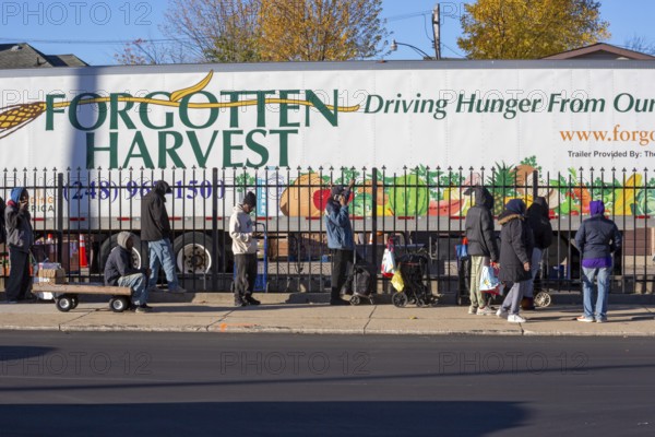 Detroit, Michigan USA - 4 November 2025 - People wait in line to pick up groceries from the anti-hunger nonprofit, Forgotten Harvest. Demand for emergency food at food pantries and soup kitchens has risen dramatically since the federal government shutdown cut SNAP benefits