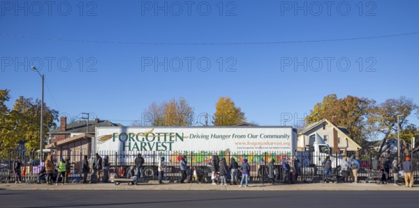 Detroit, Michigan USA - 4 November 2025 - People wait in line to pick up groceries from the anti-hunger nonprofit, Forgotten Harvest. Demand at food pantries and soup kitchens has risen dramatically since the federal government shutdown cut SNAP benefits