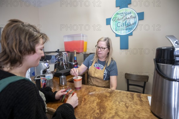 Detroit, Michigan USA - 4 November 2025 - A volunteer makes coffee for a client at the nonprofit Deo Gratias Cafe, operated by theFelician Sisters. Demand for emergency food at food pantries and soup kitchens has risen dramatically since the federal government shutdown cut SNAP benefits