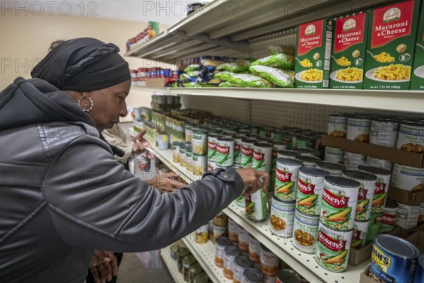 Detroit, Michigan USA - 4 November 2025 - People pick up groceries at the nonprofit Deo Gratias Food Pantry, operated by theFelician Sisters. Demand for emergency food at food pantries and soup kitchens has risen dramatically since the federal government shutdown cut SNAP benefits