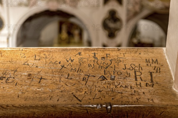 Initials, inscriptions, signs, doodles, graffiti, carved by bored churchgoers in church stalls, gallery on the central aisle of the Freising Cathedral of St. Maria and St. Korbinian, Freising, Upper Bavaria, Bavaria, Germany