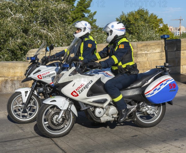 Two motorcycle police officers sitting on their motorbikes, Zaragoza, Aragon, Spain