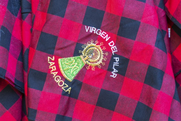 Traditional red chequered scarf worn during fiesta Virgen del Pilar Zaragoza, Aragon, Spain