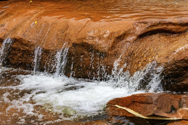 Waterfall with water flowing between the rocks in Minas Gerais, Brazil
