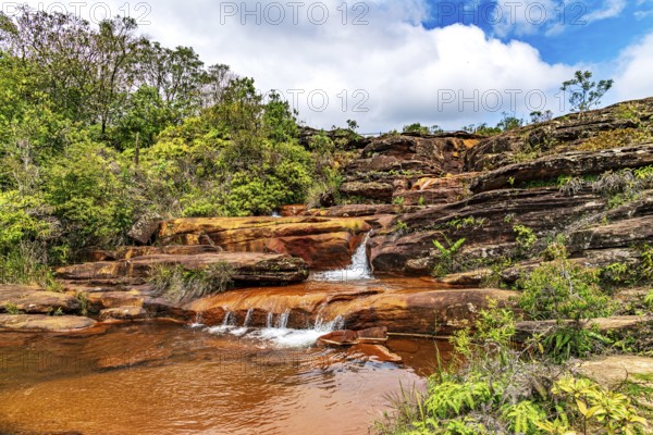 Stream flowing over rocks and forming small waterfalls in the state of Minas Gerais, Brazil, Minas Gerais, Brazil