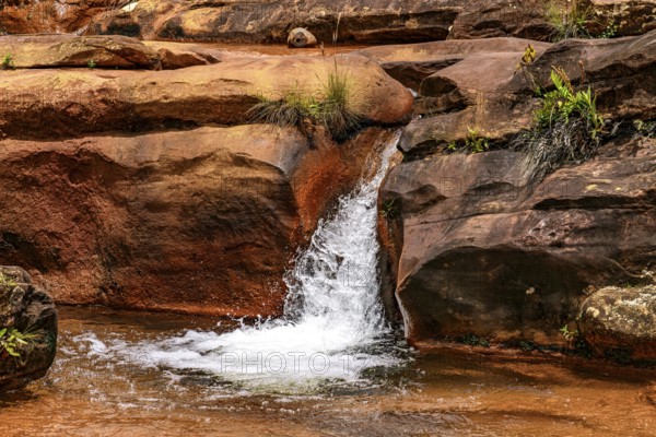 Cascade with water flowing between the rocks in Minas Gerais, Brazil