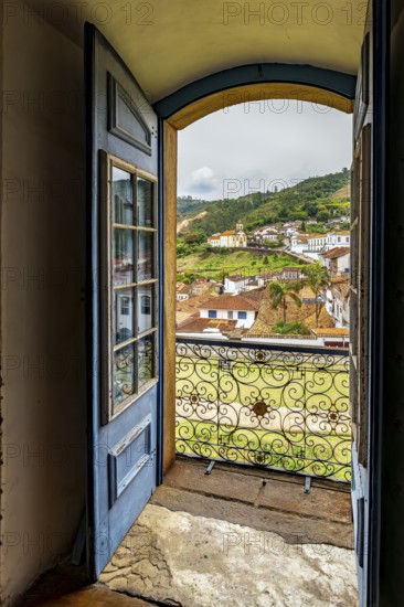 The city of Ouro Preto viewed through the doorway of one of its historic Baroque churches, Ouro Preto, Minas Gerais, Brazil