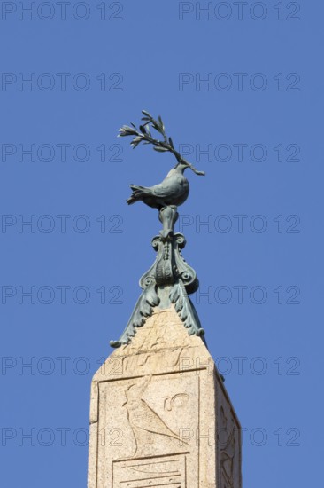 Peace dove bird sculture on the top of a building in the city of Rome, Italy