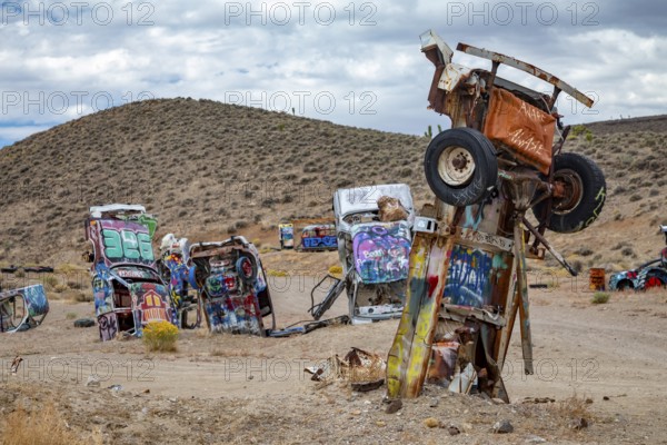 Goldfield, Nevada - The International Car Forest of the Last Church. Artist Mark Rippie has partially buried or decorated several dozen junk cars