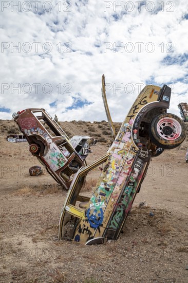 Goldfield, Nevada - The International Car Forest of the Last Church. Artist Mark Rippie has partially buried or decorated several dozen junk cars