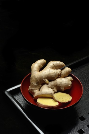 Ginger, ginger root in tea bowl, Zingiber officinale, tea preparation
