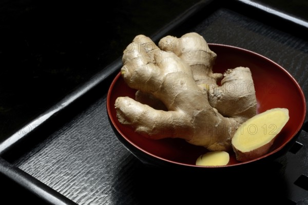 Ginger, ginger root in tea bowl, Zingiber officinale, tea preparation