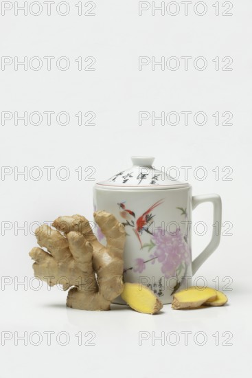 Ginger root with cup, ginger tea