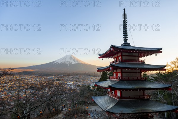 Five-story pagoda of a Shinto Shrine, Chureito Pagoda, with views of Fujiyoshida City and Mount Fuji volcano at sunset, Arakura Fuji Sengen Shrine, Arakurayama Sengen Park, Yamanashi Prefecture, Japan