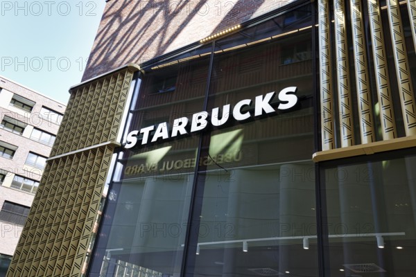 Glass façade with Starbucks lettering, Westfield Überseequartier, modern shopping center, HafenCity, Hamburg, Germany