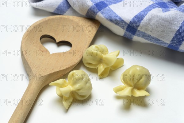 Saccottini, type of Italian pasta and cooking spoon with heart, pasta from Italy